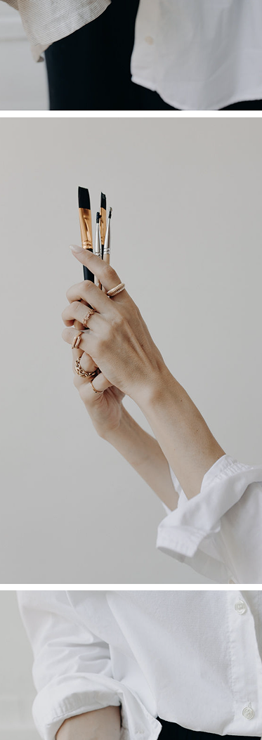 Laura Peterman, hands holding paint brushes